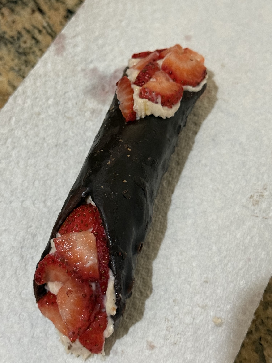 Chocolate covered cannoli with fresh strawberries
